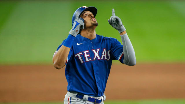 Sep 6, 2020; Seattle, Washington, USA; Texas Rangers first baseman Ronald Guzman (11) celebrates after hitting a solo-home run against the Seattle Mariners during the ninth inning at T-Mobile Park. Mandatory Credit: Joe Nicholson-USA TODAY Sports